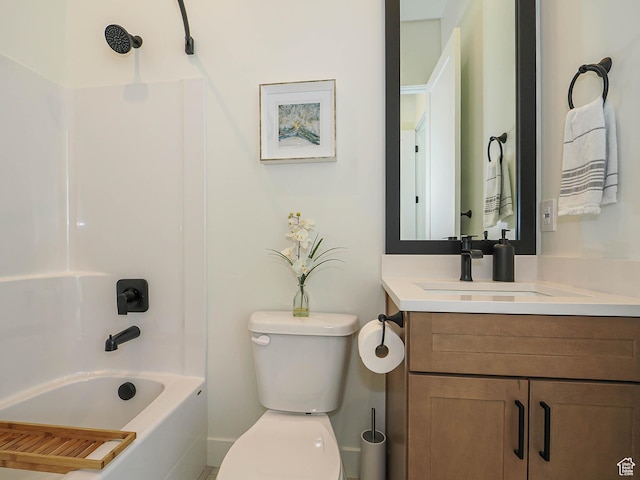bathroom featuring toilet, vanity, and bathing tub / shower combination