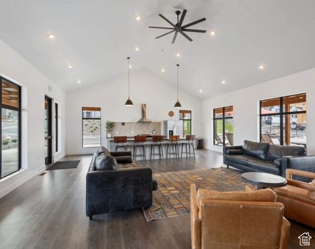 living area with dark wood-style flooring, a ceiling fan, high vaulted ceiling, and recessed lighting