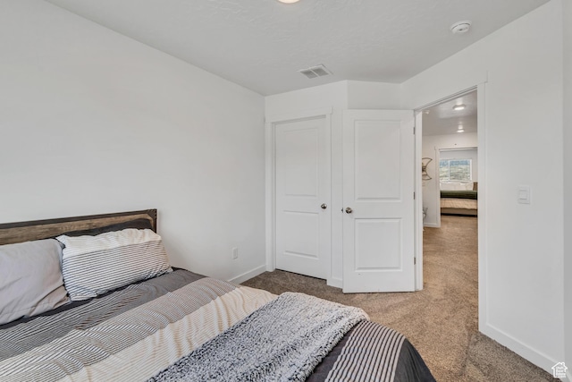 carpeted bedroom with baseboards