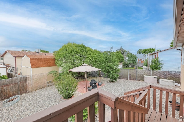 7963 S 2800 W, West Jordan, UT 84088 - wooden terrace with a fenced backyard and a patio area