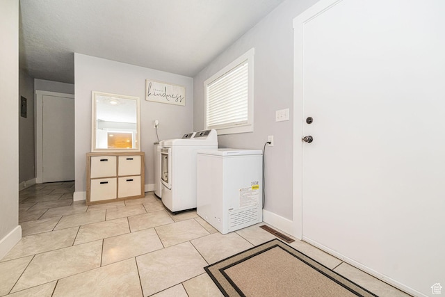 4302 W 2350 N, Plain City, UT 84404 - washroom featuring washing machine and clothes dryer, baseboards, and healthy amount of natural light