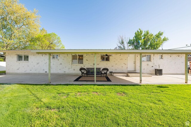 4302 W 2350 N, Plain City, UT 84404 - back of property with a patio, a yard, a ceiling fan, and stucco siding