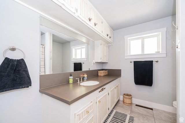 4302 W 2350 N, Plain City, UT 84404 - full bathroom with tile patterned flooring, healthy amount of natural light, baseboards, and vanity