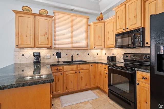 kitchen with black appliances, a sink, backsplash, and light brown cabinetry