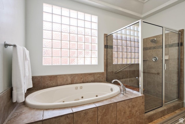full bath featuring a shower stall and a jetted tub
