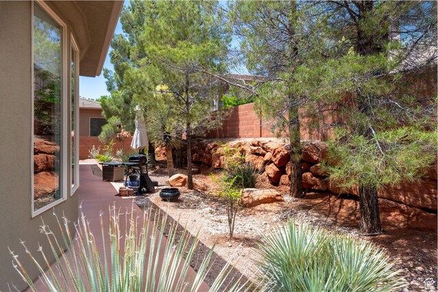 view of patio / terrace featuring fence