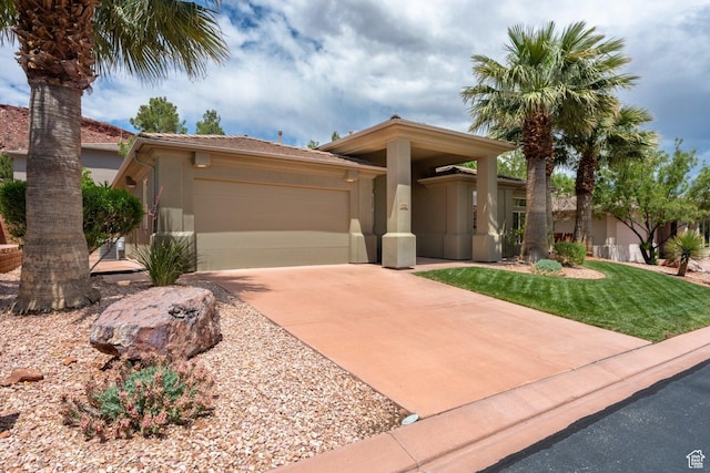 view of front facade featuring stucco siding, a garage, concrete driveway, and a tiled roof