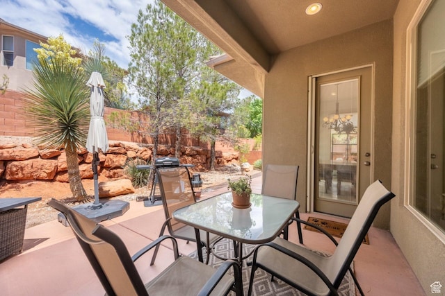 view of patio / terrace featuring fence and outdoor dining space