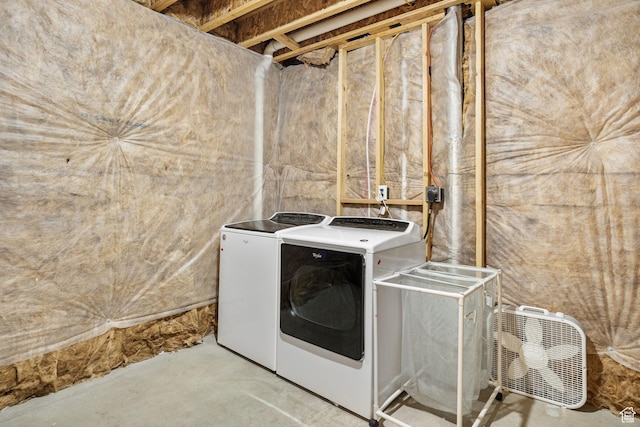clothes washing area featuring washer and clothes dryer