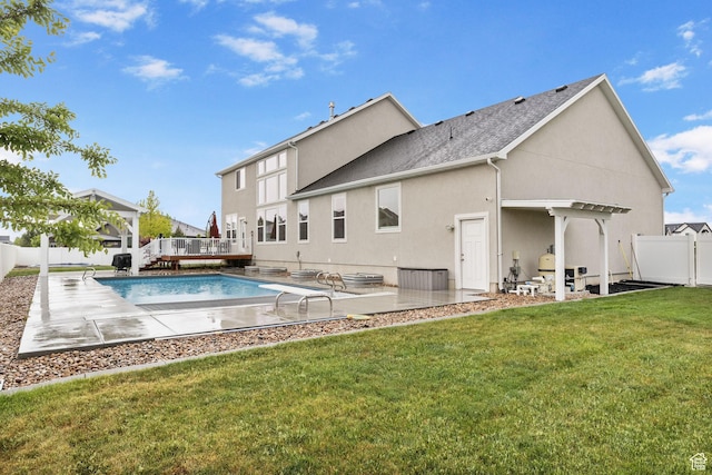 back of property featuring a pergola, stucco siding, roof with shingles, and a patio