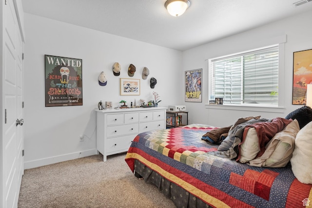 bedroom featuring light colored carpet and baseboards