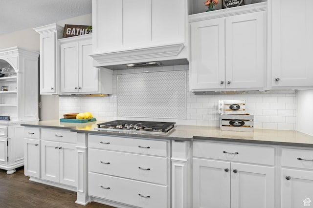 kitchen featuring stainless steel gas cooktop, white cabinetry, open shelves, dark wood-style flooring, and tasteful backsplash