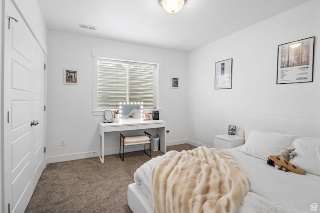 carpeted bedroom featuring baseboards