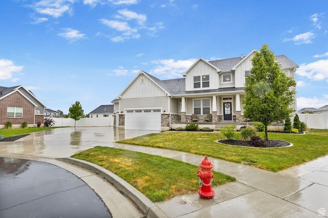craftsman-style home with board and batten siding, concrete driveway, covered porch, and stone siding