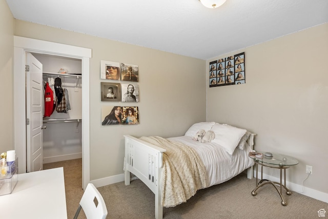 bedroom with carpet, a closet, and baseboards