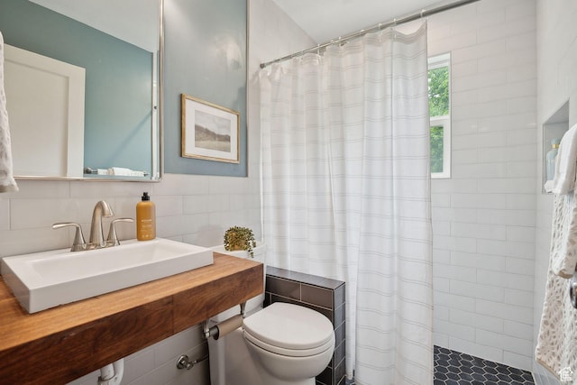 2484 S 800 E, Salt Lake City, UT 84106 - bathroom featuring a sink, tile walls, tiled shower, and toilet