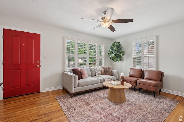 2484 S 800 E, Salt Lake City, UT 84106 - living area with light wood-style floors, a ceiling fan, and baseboards
