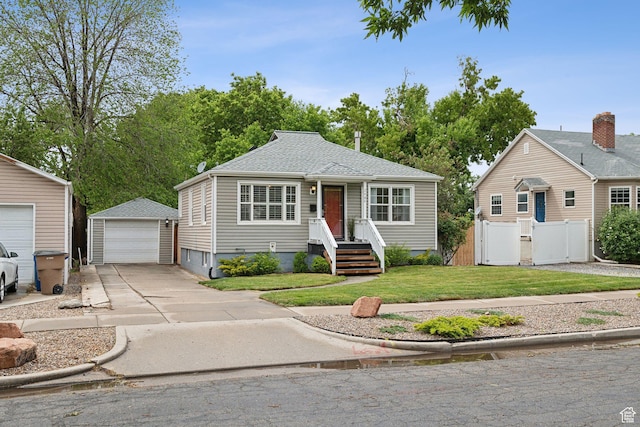 2484 S 800 E, Salt Lake City, UT 84106 - bungalow-style home with an outbuilding, a garage, a gate, and a shingled roof
