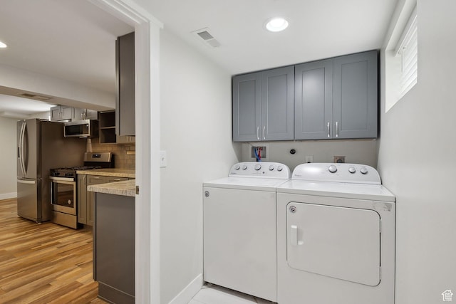 2484 S 800 E, Salt Lake City, UT 84106 - laundry area with washing machine and clothes dryer, light wood-style floors, baseboards, cabinet space, and recessed lighting