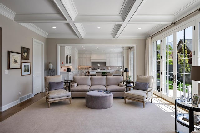 living room with beam ceiling, recessed lighting, coffered ceiling, ornamental molding, and baseboards