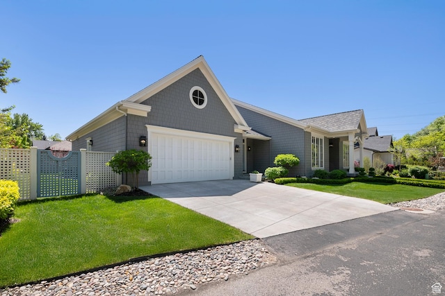 ranch-style home featuring a garage and driveway