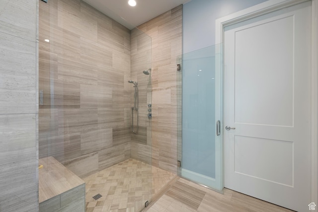 full bathroom with a stall shower and recessed lighting