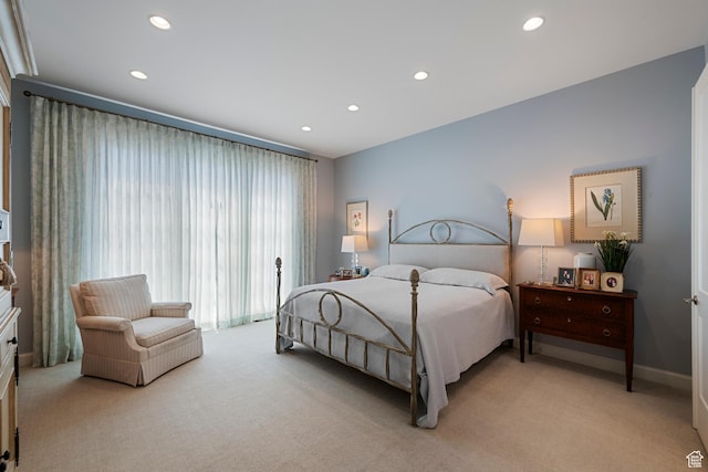 bedroom featuring light colored carpet, recessed lighting, and baseboards