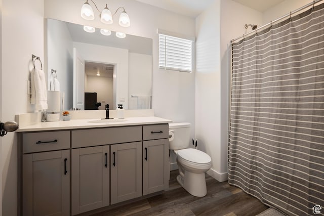 311 S 1130 W Unit 24, American Fork, UT 84003 - bathroom featuring wood finished floors, vanity, toilet, and curtained shower