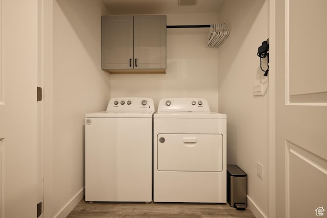 311 S 1130 W Unit 24, American Fork, UT 84003 - washroom with washer and dryer, cabinet space, light wood finished floors, and baseboards