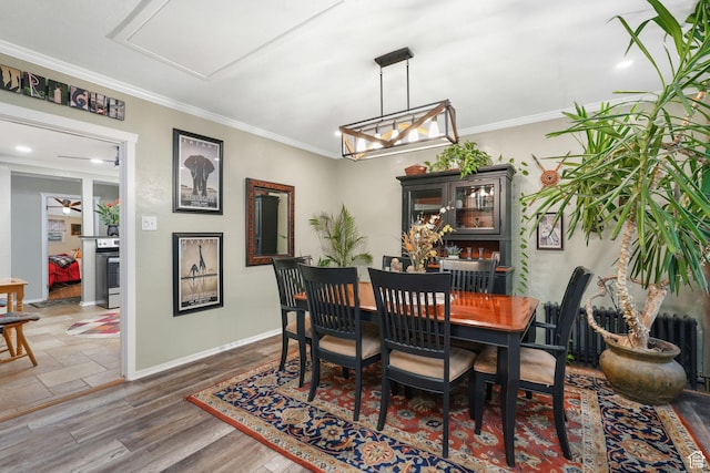821 E 100 S, Salt Lake City, UT 84102 - dining space featuring baseboards, crown molding, and wood finished floors
