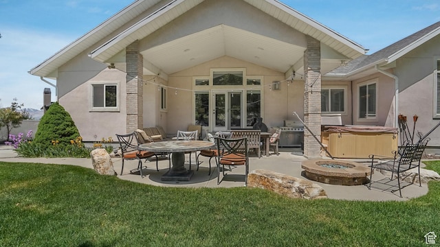 1776 E Horizon Point Cir, Draper, UT 84020 - back of house with a hot tub, a patio, stucco siding, and an outdoor fire pit