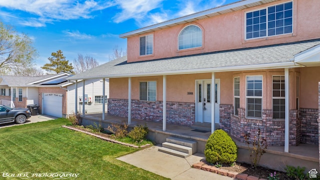 1688 N 175 W, Cedar City, UT 84721 - view of front of property featuring stucco siding, covered porch, a front lawn, an attached garage, and roof with shingles