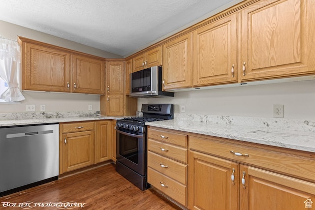 1688 N 175 W, Cedar City, UT 84721 - kitchen with stainless steel appliances, dark wood-style flooring, light stone countertops, and a textured ceiling