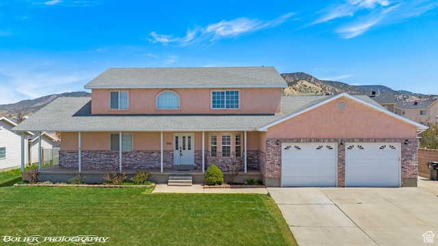 1688 N 175 W, Cedar City, UT 84721 - view of front facade featuring stucco siding, a garage, concrete driveway, a porch, and a front yard