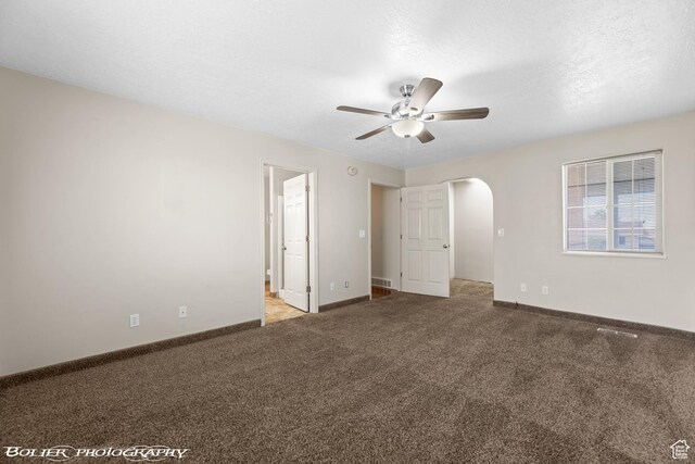 1688 N 175 W, Cedar City, UT 84721 - unfurnished bedroom with arched walkways, carpet flooring, baseboards, and ensuite bathroom