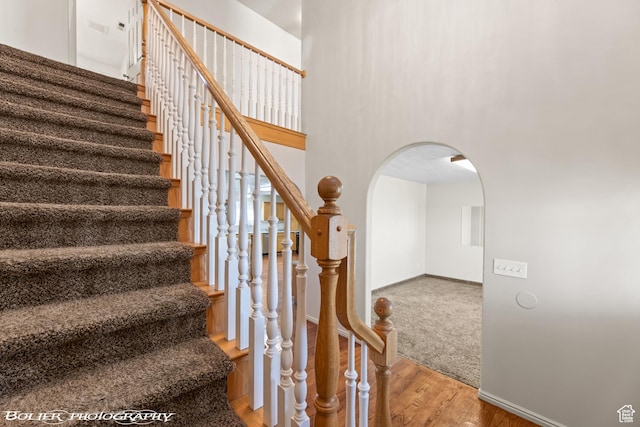 1688 N 175 W, Cedar City, UT 84721 - staircase featuring arched walkways, wood finished floors, baseboards, and a high ceiling