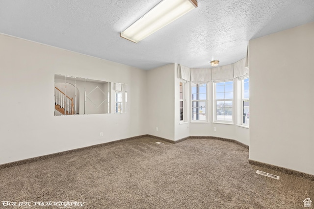 1688 N 175 W, Cedar City, UT 84721 - spare room featuring healthy amount of natural light, carpet floors, a textured ceiling, and baseboards