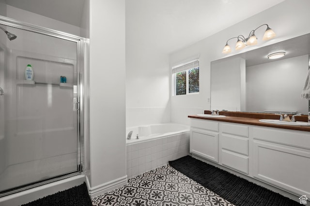 bathroom with a stall shower, a garden tub, double vanity, and tile patterned floors