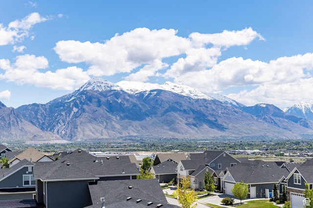 view of mountain background with nearby suburban area