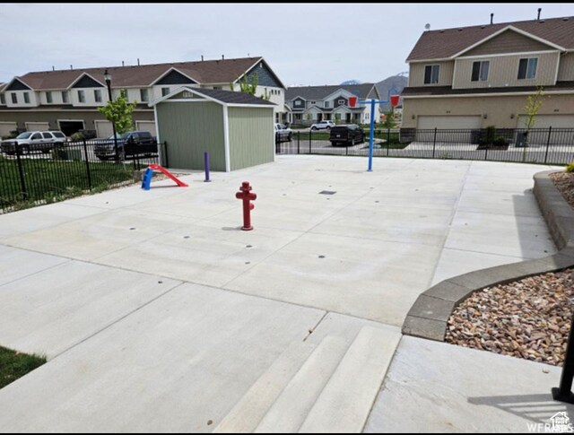 98 E 1040 N Unit 134, Santaquin, UT 84655 - view of home's community featuring a residential view, fence, an attached garage, and concrete driveway