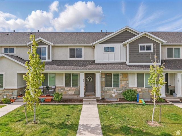 98 E 1040 N Unit 134, Santaquin, UT 84655 - view of property with stone siding, a front lawn, and stucco siding
