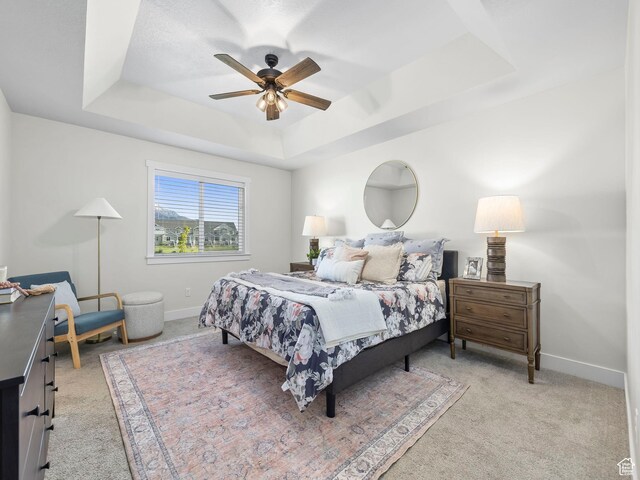 98 E 1040 N Unit 134, Santaquin, UT 84655 - bedroom featuring a raised ceiling, light carpet, baseboards, and ceiling fan