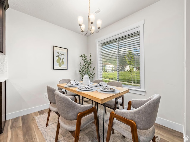 98 E 1040 N Unit 134, Santaquin, UT 84655 - dining area with a chandelier, baseboards, and light wood-style floors