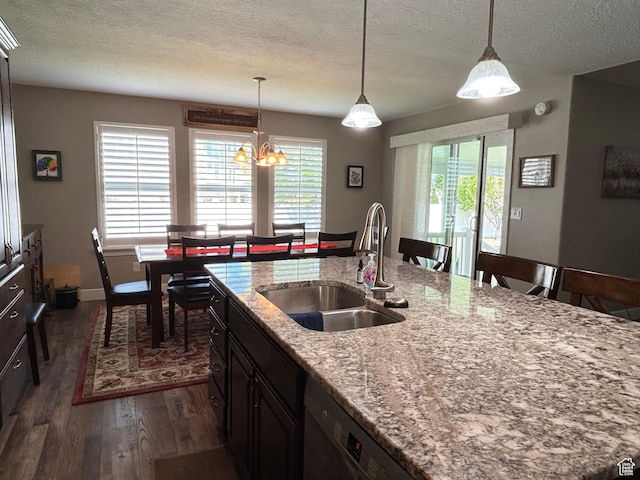 1522 S 1100 E, Spanish Fork, UT 84660 - kitchen featuring a sink, dark wood-style flooring, a textured ceiling, decorative light fixtures, and light stone counters
