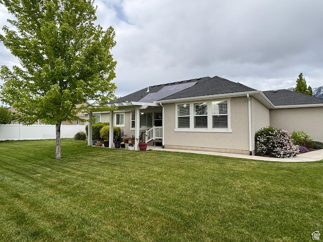 1522 S 1100 E, Spanish Fork, UT 84660 - view of front of house featuring roof mounted solar panels, stucco siding, and a shingled roof