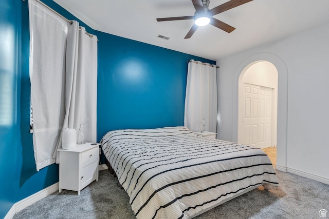 274 N Foxboro Dr, North Salt Lake, UT 84054 - carpeted bedroom featuring baseboards, a ceiling fan, and arched walkways