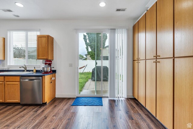 274 N Foxboro Dr, North Salt Lake, UT 84054 - kitchen with stainless steel dishwasher, a sink, dark wood-type flooring, recessed lighting, and dark countertops