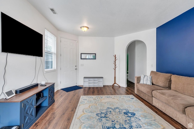 274 N Foxboro Dr, North Salt Lake, UT 84054 - living area with arched walkways, wood finished floors, and baseboards