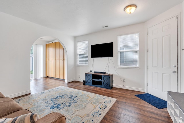 274 N Foxboro Dr, North Salt Lake, UT 84054 - living room with arched walkways, wood finished floors, and baseboards