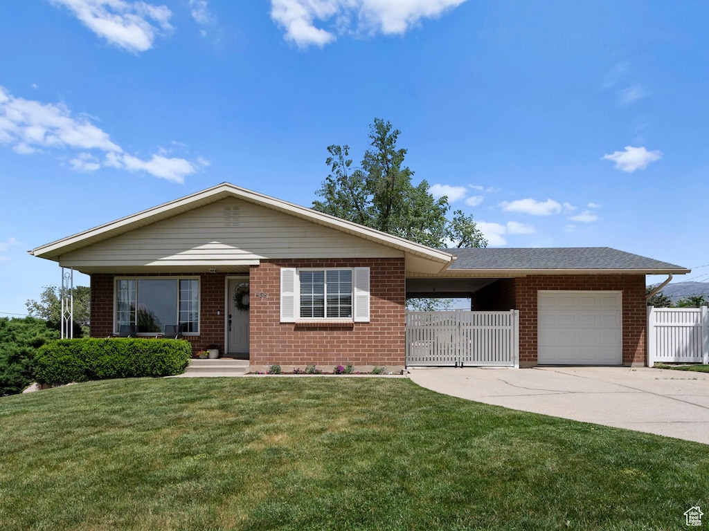 single story home featuring concrete driveway, a garage, and brick siding